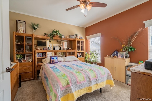 7885 Buckhorn Grn Unit 131, Frederick, CO 80530 - bedroom featuring light colored carpet, crown molding, and ceiling fan
