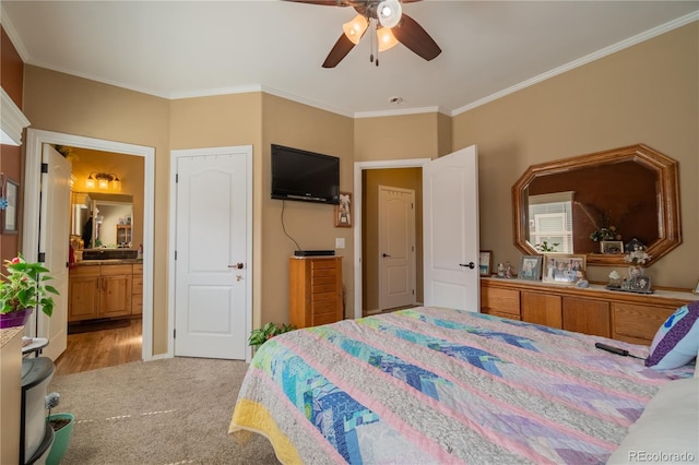 7885 Buckhorn Grn Unit 131, Frederick, CO 80530 - bedroom featuring ornamental molding, carpet floors, ensuite bath, and a ceiling fan