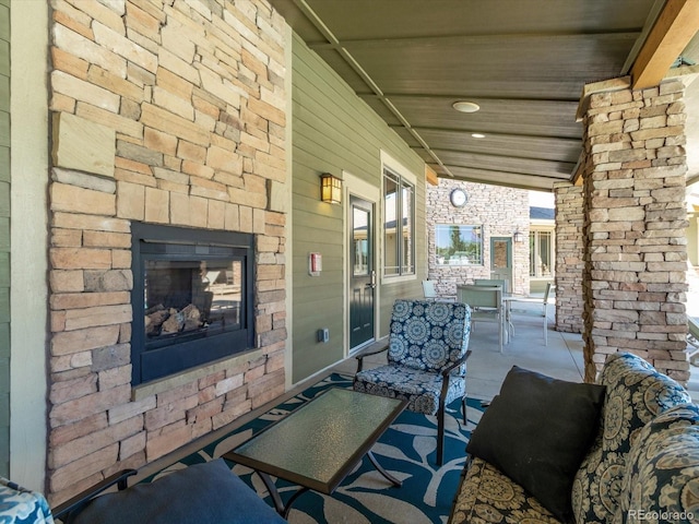 7885 Buckhorn Grn Unit 131, Frederick, CO 80530 - covered porch featuring an outdoor stone fireplace