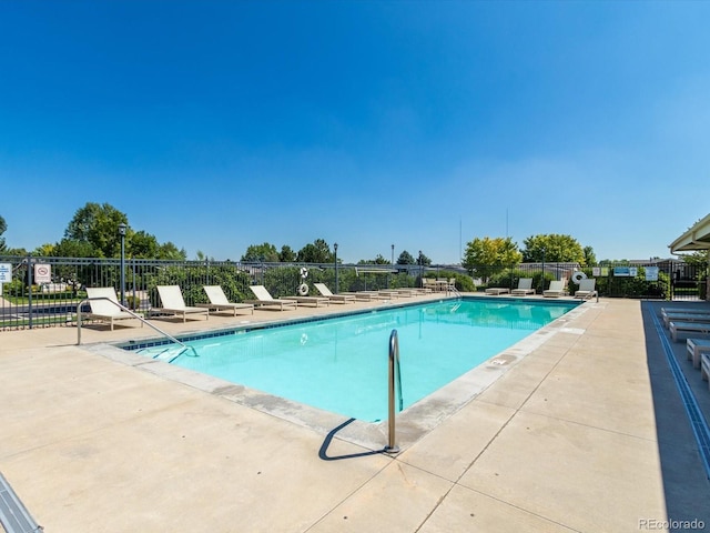 7885 Buckhorn Grn Unit 131, Frederick, CO 80530 - community pool featuring a patio area