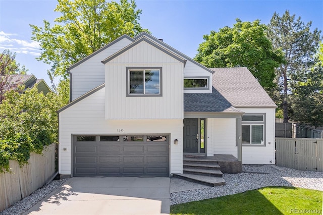 2640 Overlook Dr, Broomfield, CO 80020 - view of front facade with an attached garage, driveway, and roof with shingles