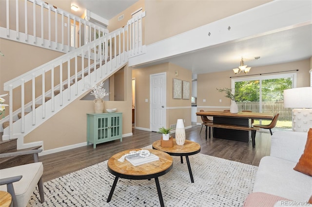 2640 Overlook Dr, Broomfield, CO 80020 - living room with stairway, wood finished floors, a chandelier, and a high ceiling