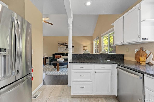 2640 Overlook Dr, Broomfield, CO 80020 - kitchen featuring appliances with stainless steel finishes, ceiling fan, white cabinetry, a peninsula, and lofted ceiling