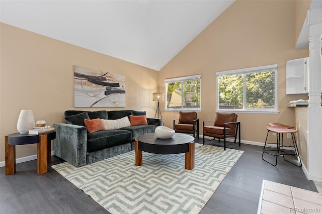 2640 Overlook Dr, Broomfield, CO 80020 - living area featuring high vaulted ceiling, dark wood-style flooring, and decorative columns