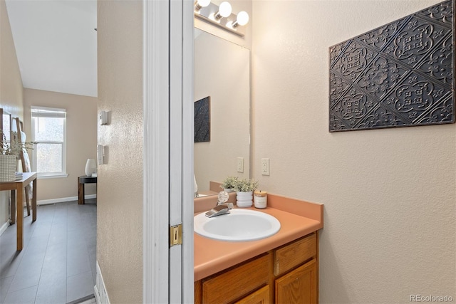 2640 Overlook Dr, Broomfield, CO 80020 - bathroom with vanity, tile patterned floors, and a textured wall
