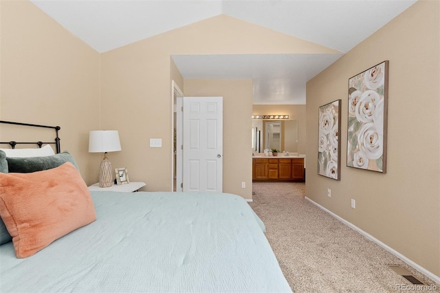 2640 Overlook Dr, Broomfield, CO 80020 - carpeted bedroom featuring lofted ceiling and ensuite bathroom