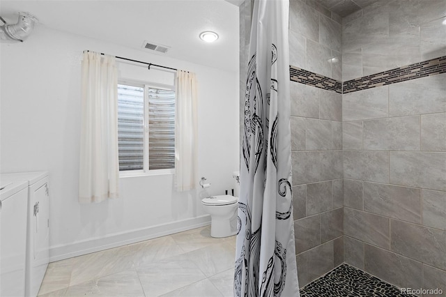 2640 Overlook Dr, Broomfield, CO 80020 - full bathroom with washer and dryer, tiled shower, and vanity