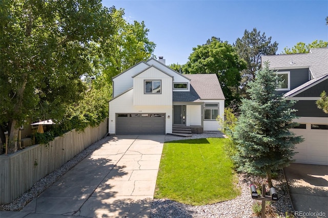 2640 Overlook Dr, Broomfield, CO 80020 - view of front facade featuring driveway, a garage, and a chimney