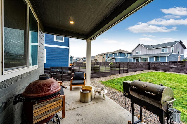 view of patio featuring a residential view, area for grilling, and fence private yard