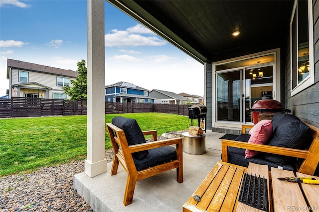 view of patio / terrace featuring a fenced backyard, a residential view, and area for grilling