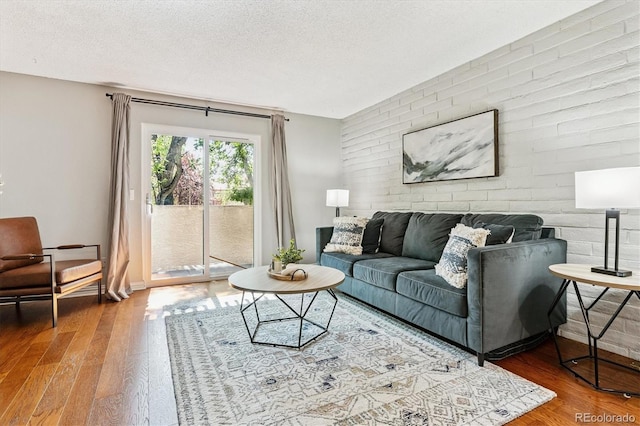 1060 S Parker Rd Unit 25, Denver, CO 80231 - living room featuring wood finished floors and a textured ceiling