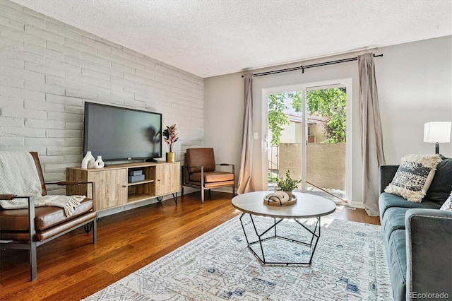 1060 S Parker Rd Unit 25, Denver, CO 80231 - living room with wood finished floors and a textured ceiling