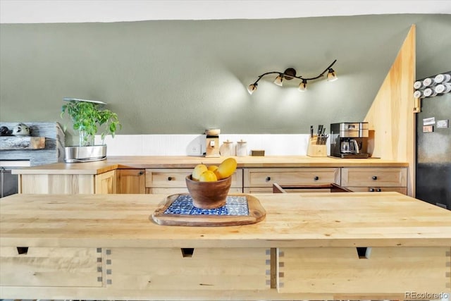 kitchen with light brown cabinets and butcher block countertops