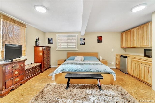 bedroom with baseboards, beamed ceiling, and refrigerator