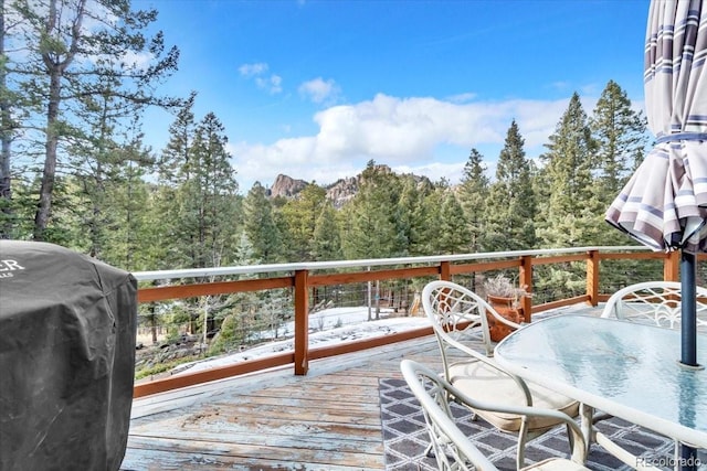 wooden deck with grilling area