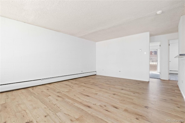 10185 W 25th Ave Unit 33, Lakewood, CO 80215 - spare room featuring wood finished floors, a baseboard heating unit, and a textured ceiling