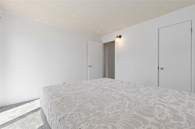 10185 W 25th Ave Unit 33, Lakewood, CO 80215 - carpeted bedroom featuring a textured ceiling and crown molding