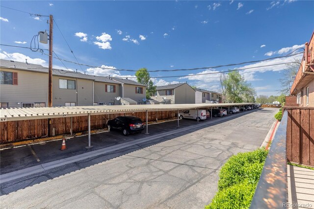 10185 W 25th Ave Unit 33, Lakewood, CO 80215 - covered parking lot with a residential view and fence