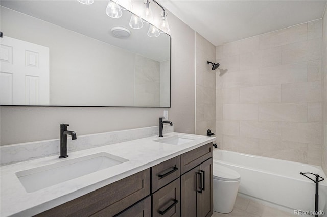 bathroom featuring a sink, shower / bathing tub combination, toilet, and double vanity