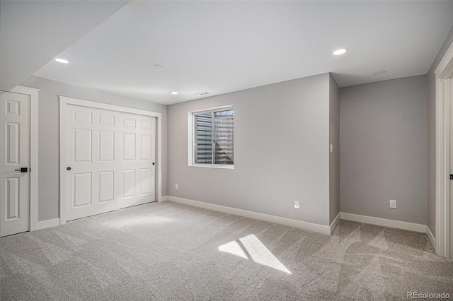 unfurnished bedroom featuring recessed lighting, baseboards, and carpet floors