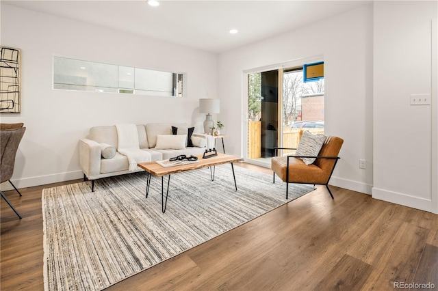 living room featuring wood finished floors, baseboards, and recessed lighting