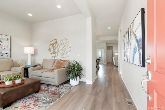 21209 E 62nd Ave, Aurora, CO 80019 - living area with light wood-style flooring, recessed lighting, and baseboards