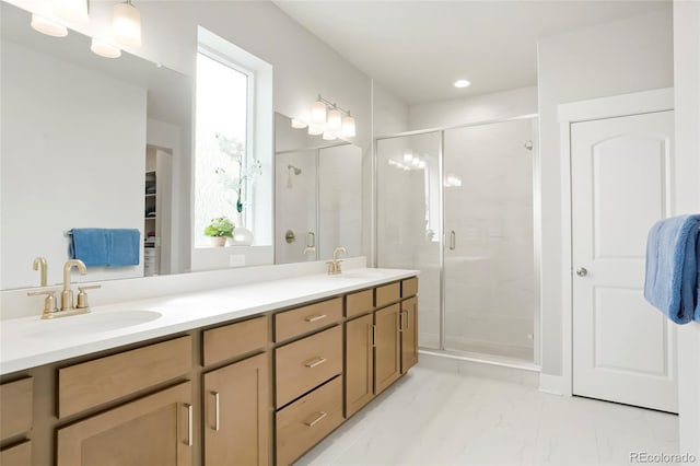 21209 E 62nd Ave, Aurora, CO 80019 - bathroom featuring double vanity, a stall shower, marble look tiles, a walk in closet, and recessed lighting
