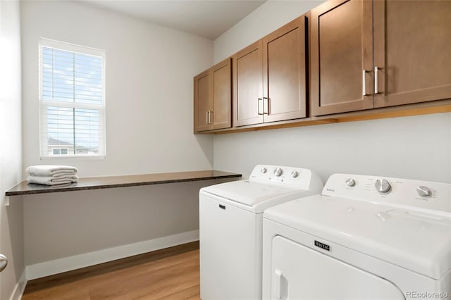 21209 E 62nd Ave, Aurora, CO 80019 - laundry area with washing machine and dryer, cabinet space, and light wood-style flooring