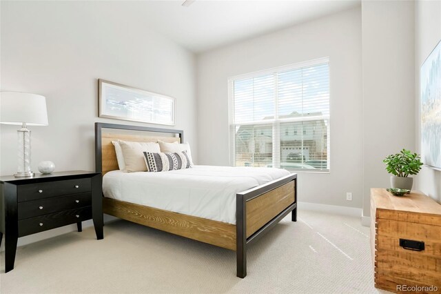 21209 E 62nd Ave, Aurora, CO 80019 - bedroom with light colored carpet and baseboards