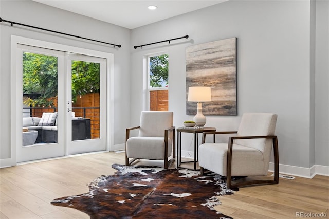 2111 S Franklin St, Denver, CO 80210 - living area with plenty of natural light, wood finished floors, and recessed lighting
