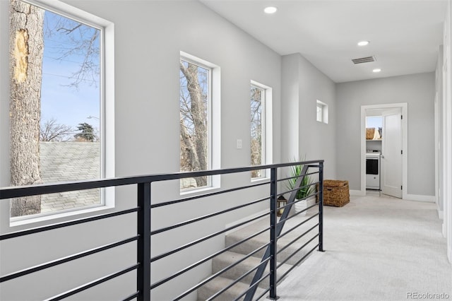 2111 S Franklin St, Denver, CO 80210 - corridor with an upstairs landing, light colored carpet, and recessed lighting