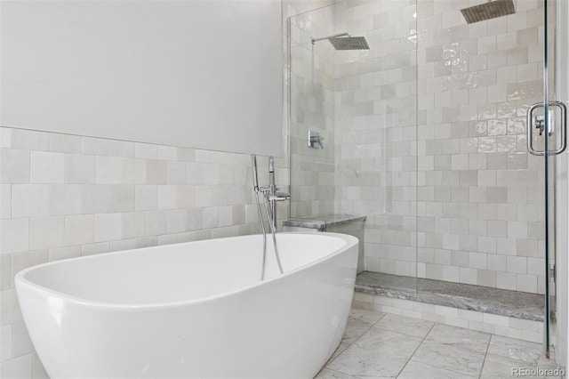 2111 S Franklin St, Denver, CO 80210 - full bath with a stall shower, a freestanding tub, and tile walls