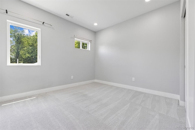2111 S Franklin St, Denver, CO 80210 - spare room featuring light colored carpet and recessed lighting