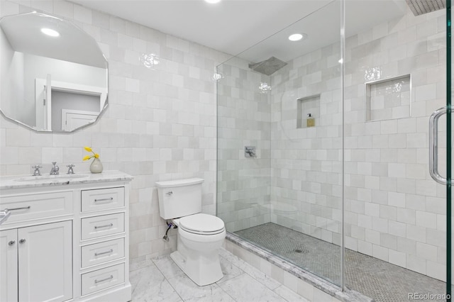 2111 S Franklin St, Denver, CO 80210 - full bathroom with tile walls, vanity, a stall shower, recessed lighting, and marble finish flooring