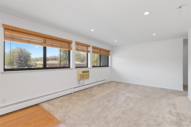 745 Thomas Dr Unit 2, Boulder, CO 80303 - empty room with baseboard heating, carpet flooring, recessed lighting, and a wall unit AC