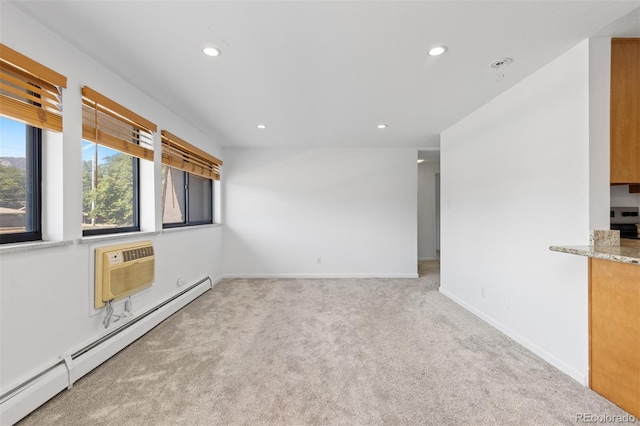 745 Thomas Dr Unit 2, Boulder, CO 80303 - carpeted empty room featuring a baseboard heating unit, recessed lighting, and a wall mounted AC
