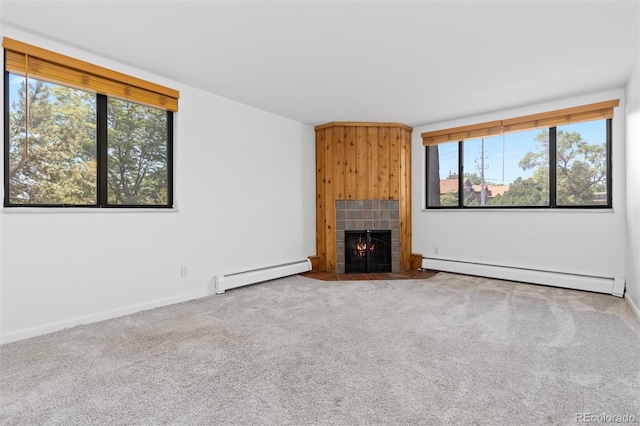 745 Thomas Dr Unit 2, Boulder, CO 80303 - unfurnished living room featuring a baseboard heating unit, a fireplace, and carpet floors