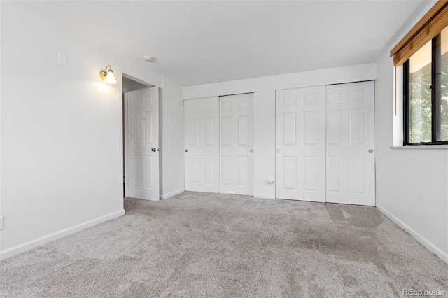 745 Thomas Dr Unit 2, Boulder, CO 80303 - unfurnished bedroom with multiple closets and carpet