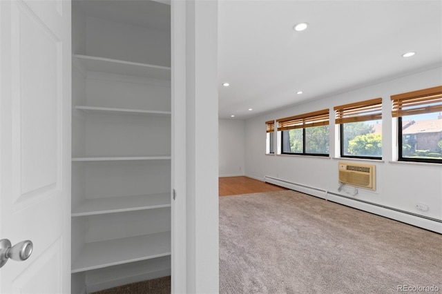 745 Thomas Dr Unit 2, Boulder, CO 80303 - empty room with carpet flooring, recessed lighting, an AC wall unit, and baseboard heating