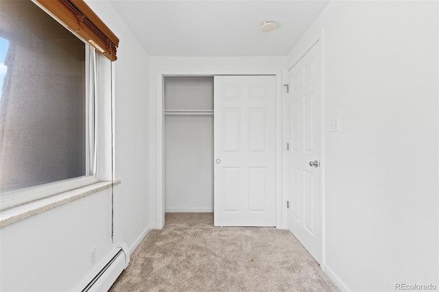745 Thomas Dr Unit 2, Boulder, CO 80303 - unfurnished bedroom featuring light colored carpet, a baseboard heating unit, and a closet