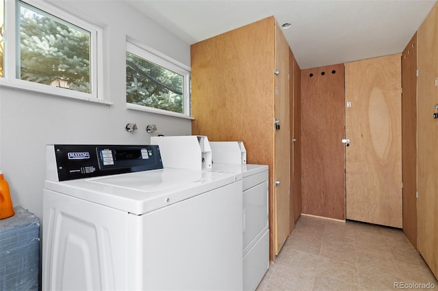 745 Thomas Dr Unit 2, Boulder, CO 80303 - communal laundry room with washer and dryer and light tile patterned flooring