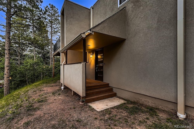 view of side of property with stucco siding