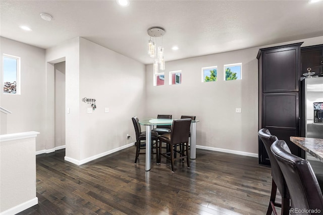18651 E 53rd Ave, Denver, CO 80249 - dining space featuring dark wood finished floors, baseboards, and recessed lighting