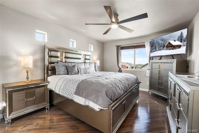18651 E 53rd Ave, Denver, CO 80249 - bedroom with dark wood-style flooring, baseboards, and a ceiling fan