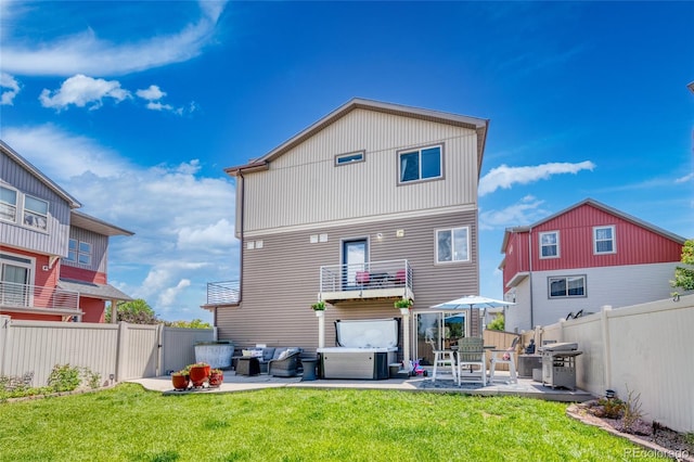 18651 E 53rd Ave, Denver, CO 80249 - rear view of house featuring a patio, an outdoor hangout area, and a balcony