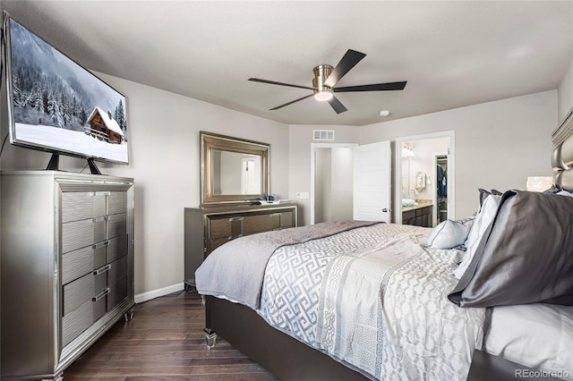 18651 E 53rd Ave, Denver, CO 80249 - bedroom with dark wood-style floors, baseboards, ceiling fan, and ensuite bath