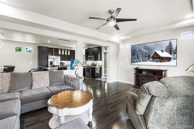18651 E 53rd Ave, Denver, CO 80249 - living room with dark wood-style floors, a ceiling fan, recessed lighting, and baseboards