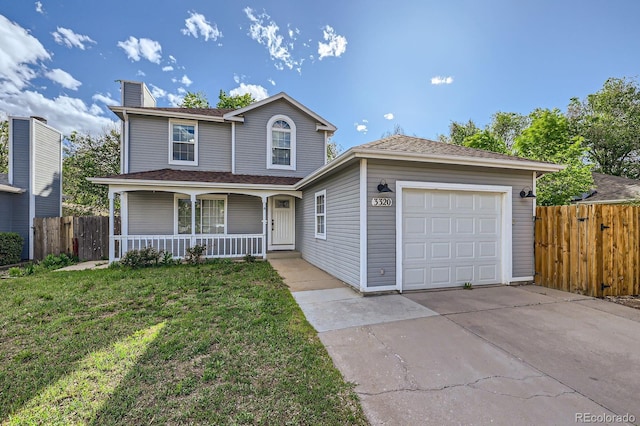 3320 Simmelink Loop, Colorado Springs, CO 80916 - traditional-style home with covered porch, driveway, a chimney, and an attached garage