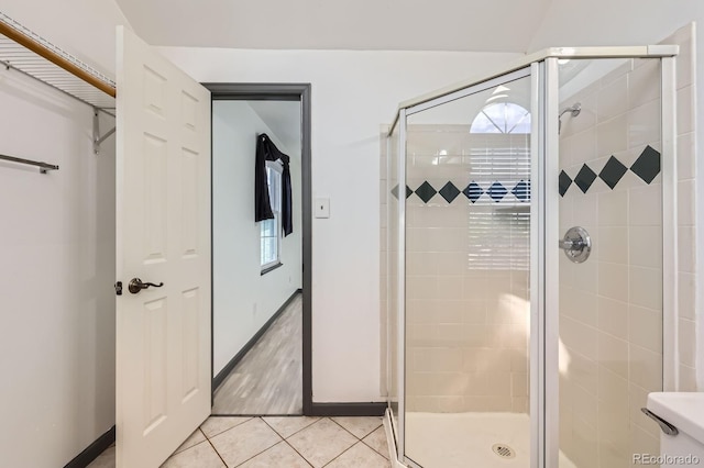 3320 Simmelink Loop, Colorado Springs, CO 80916 - bathroom with tile patterned floors, a stall shower, and baseboards