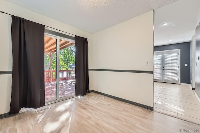 3320 Simmelink Loop, Colorado Springs, CO 80916 - unfurnished room with baseboards, light wood-style flooring, and recessed lighting